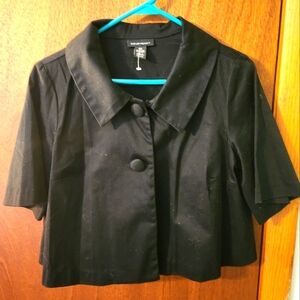 Black cropped short sleeve dress jacket.
